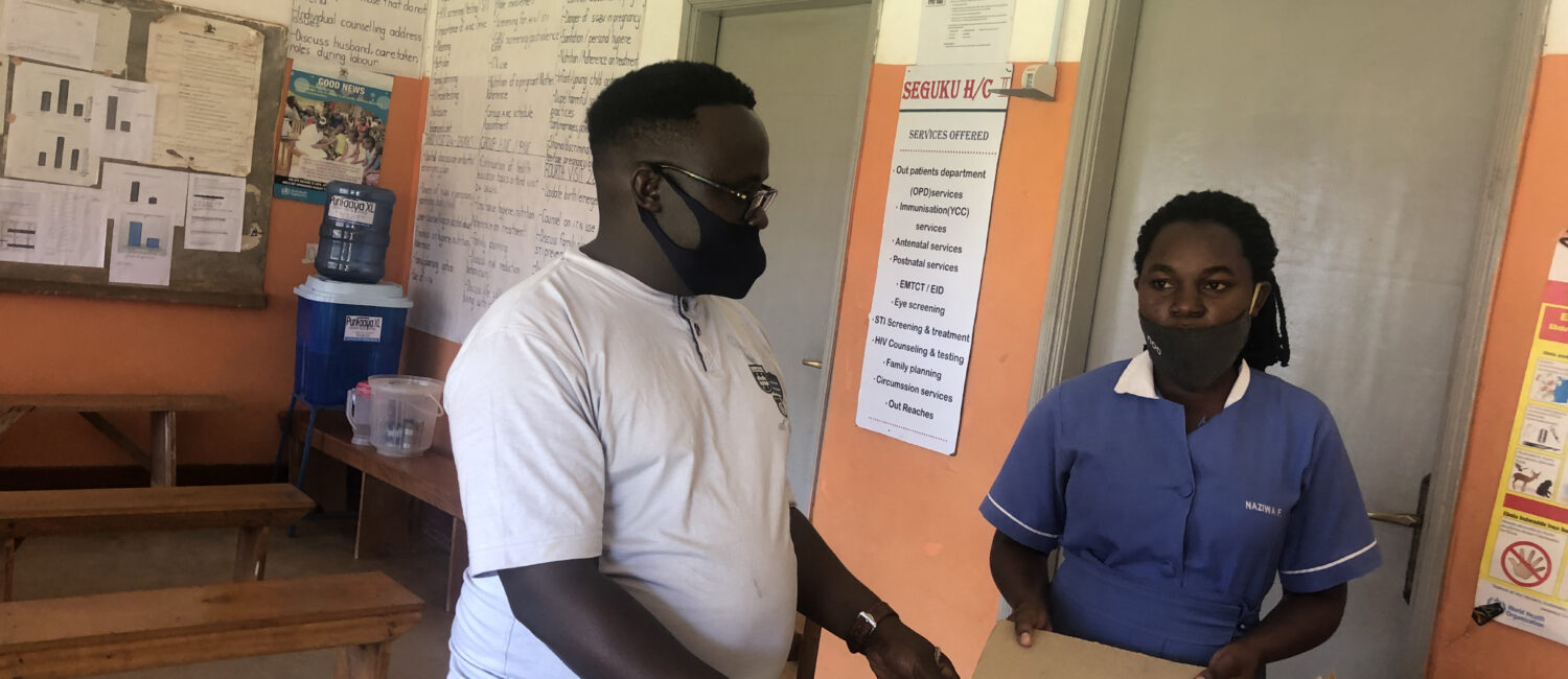 Dr. Busonga hands over RHU donated medicines to Seguku Health Center II